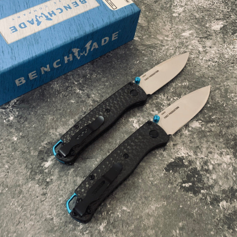 Ball-bearing folding knife with carbon fiber handle and S90V steel blade—a high-hardness, portable, multi-functional tool for camping and outdoor use.