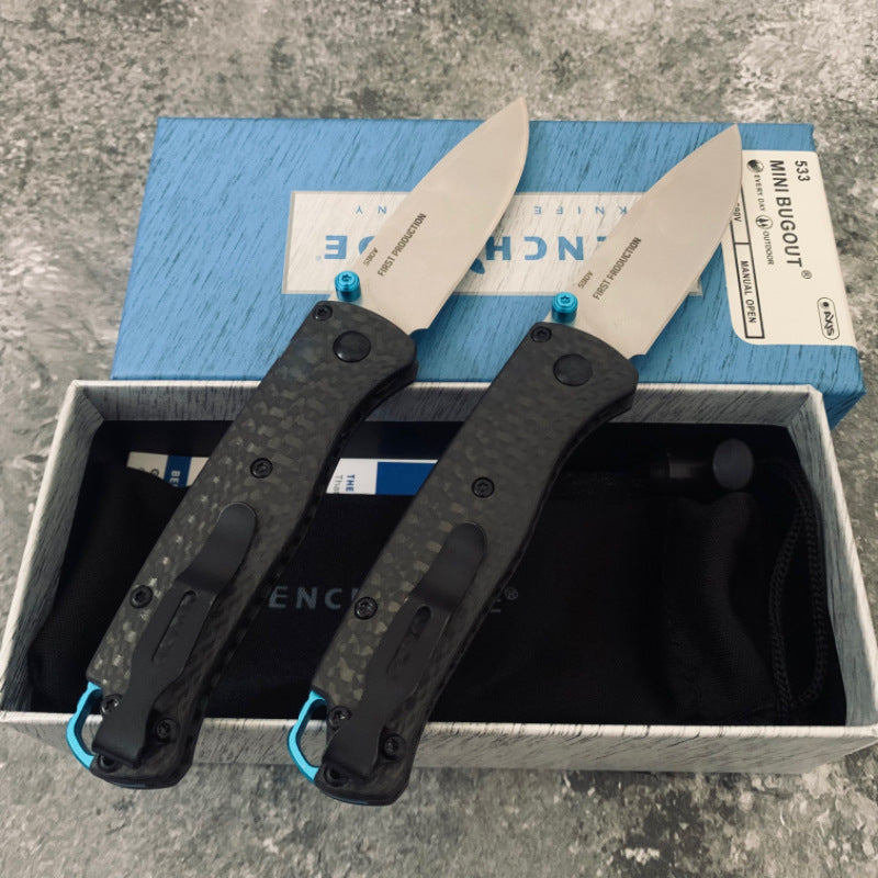 Ball-bearing folding knife with carbon fiber handle and S90V steel blade—a high-hardness, portable, multi-functional tool for camping and outdoor use.